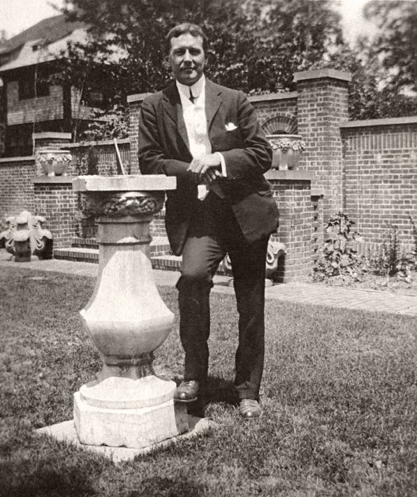 John_McCrae_leaning_against_a_sundial (1).jpg